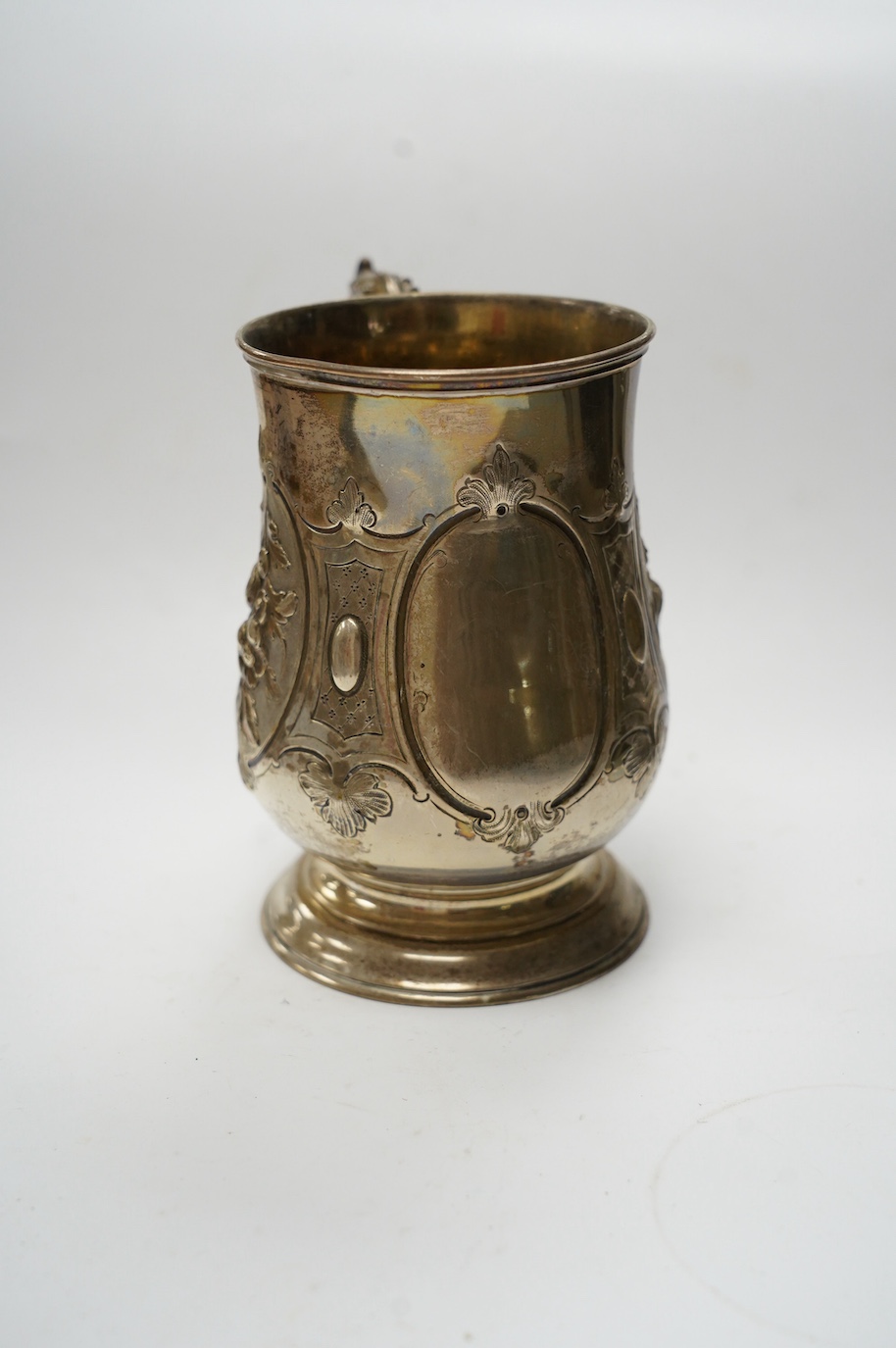 A Victorian repousse silver baluster mug, by Robert Harper, London, 1868, height 13.1cm, 8.9oz. Condition - fair